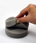 Close-up of a hand holding foam applicator from the All in One Paint Tool Trio With Syntec Brush, Roller, And Applicator For Smooth Finish.