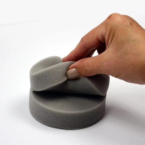 Close-up of a hand holding foam applicator from the All in One Paint Tool Trio With Syntec Brush, Roller, And Applicator For Smooth Finish.