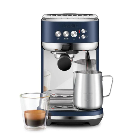 Damson Blue Kickass Espresso Coffee Maker Featuring Auto Milk Frother Quick Heat Technology And Reliable Pressure Pumping For Next Level Barista Quality Home Brews Any Day with steaming milk and espresso.