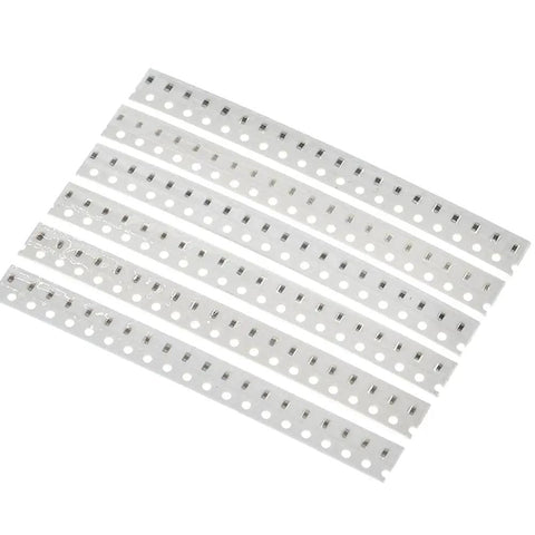 960 Piece SMD Capacitor Kit 0603 0805 1206 MLCC Assortment With 16 Values From 10pF To 22uF tapes with capacitors visible