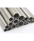 Front view of stainless steel tubing bundle with hollow tubes of varying diameters in metallic silver