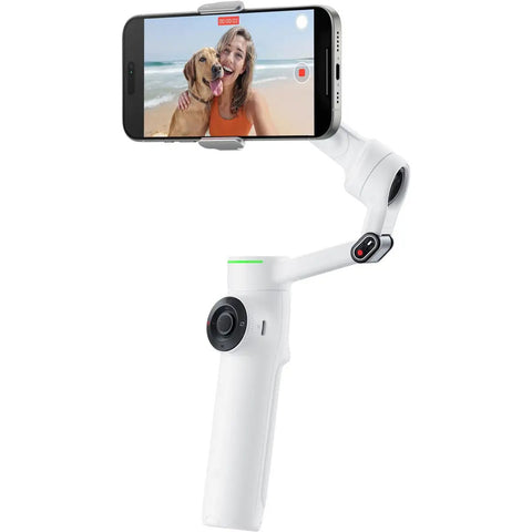 Flow 2 Pro Smartphone Gimbal With 3 Axis Stabilization And AI Tracking showing phone recording video of woman and dog on beach