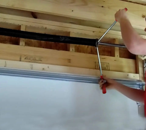 2 Pack Winding Bars For Torsion Spring Garage Doors With Premium Steel Rods And Upgraded Rubber Handle in use for adjustments