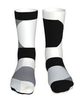 Game Changing Compression Socks For Men And Women Rocking A Dope Black And White Piano Plate Grid Pattern moisture wicking athletic gear design.