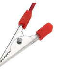 Close-up of metal alligator clip with red insulation for Hands On Fruit Battery Kit With Light Emitting Diode For Lemon Potato Orange Power Experiments.