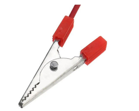 Close-up of metal alligator clip with red insulation for Hands On Fruit Battery Kit With Light Emitting Diode For Lemon Potato Orange Power Experiments.