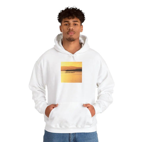 Man wearing Cozy Hooded Sweatshirt With Sunset Molokai Hawaii Outrigger Canoe Art Made From 100 Percent US Grown Cotton