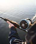 Tough As Nails Saltwater Level Wind Fishing Reel Size Thirty Featuring Graphite Housing Brass Main Gear And Smooth Multi Disc Drag System For Serious Anglers Seeking Big Catch Thrills near water
