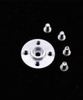 Close-up of aluminum 25T servo horn plate with central splined bore and four mounting holes, plus small screws