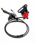 Front And Rear Brake Assembly Kit For IN 10 Electric Dirt Bike Upgrades Beefed Up Braking Power With Durable Black Rear Calipers And Discs Easy Install For Safer Rides, shown with cables and red bracket.