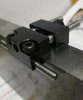 Close-up of Built Tough Milling Vise Stop Part Locator For CNC Machines Heavy Duty Steel Clamp Kit on metal surface.