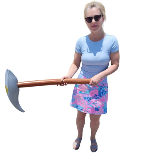 Person holding Inflatable Pick Axe Prop 33 Inch Wood And Silver Mining Tool For Party Decor And Themed Events
