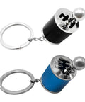 Hella Dope Two Pack Gearbox Keychain Featuring Six Speed Manual Shifter Shape With Transmission Stick Keyring in black and blue.