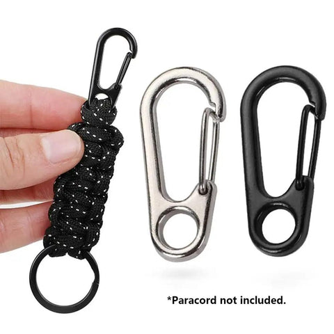 Hand holding paracord with black spring hook, two 30 Piece Mini Carabiner Clip Set, Tiny Zinc Alloy Spring Snap Hooks shown