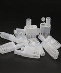 Plastic Queen Bee Cages 20 Pack Transporting Catcher Kit For Beekeeping, white durable plastic cages on black background.