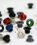 Colorful assortment of chainring bolts and nuts for 1X drivetrains, 4 mm hex bolt and 6 mm hex nut, 6 mm long for mountain and road bikes.
