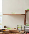 Bubble Level Vial, Spirit Level on wooden shelf during a DIY project with tools and materials in view.