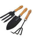 Three Kinds Of Gardening Tools Set Featuring Hooked Mattock Hand Shovel And Trident For Everyday Garden Work And Shoreline Shell Collecting On Tide Flats Built With Iron Heads And Wooden Handles In A Durable Black Finish.