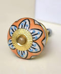 Close-up of a decorative mustard flower ceramic drawer knob with golden base, part of the 100 Piece Premium Ceramic Drawer Knobs Mustard Flower Cabinet Pulls Decorative Kitchen Drawer Hardware Rust Free Heavy Duty Set Major Home Glow Up No Sweat Install.