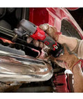 Person using M12 FUEL 16 Gauge Variable Speed Nibbler Tool Only, Cordless Sheet Metal Cutter to cut car metal