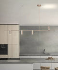 Sleek Modern 4 Light Linear Pendant Chandelier For Dining Room Kitchen Island And Living Room With GU10 Bulbs Dimmable 110V Nickel Finish 47.8 Inch Long Ceiling Light Fixture above a minimalist kitchen island.