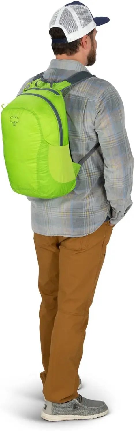 Back view of a man wearing a green Lightweight Collapsible Day Pack For Travel And Everyday Use 18L Capacity Packable Luggage Expansion Bag