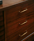 Antique Brass Cabinet Pulls Set Of Twelve Vintage Zinc Alloy Drawer Handles on wooden dresser, 5 inch length, old school vibe