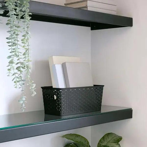 No Sweat Home Organization Decorative Storage Basket For Cube Systems And Desk Shelves, Sturdy Plastic Woven Organizer With Total Game Changer And Clean Setup Vibes In Sleek Black Medium on a shelf holding books.