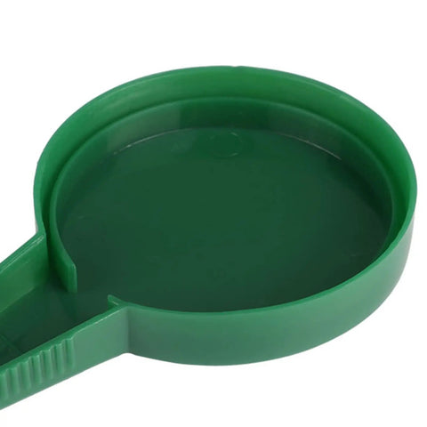 Close-up view of the green Pack Of 2 Handheld Seed Spreader And Dial Seed Dispenser Sower With 5 Adjustable Settings gardening tool.