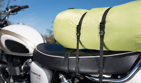 Beefy Heavy Duty Reflective Adjustable Cargo Stretch Strap For Motorcycles And ATVs 18 To 60 Inch 100 Lb Capacity securing a bag on a bike