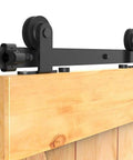 Close-up of 6-Foot Sliding Barn Door Hardware Kit For Single Wood Door Heavy-Duty T-Shaped Black Track System DIY Ready