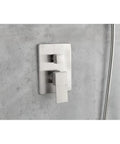 Shower System with Waterfall Rainfall Head, Handheld, Wall-Mounted Faucet controls on a modern concrete wall.