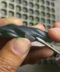 Using Olive Shape Diamond Burr Set, 11 Pcs, 3 By 32 Inch Shank Mounted Grinding Bits For Rotary Tool on stone piece.