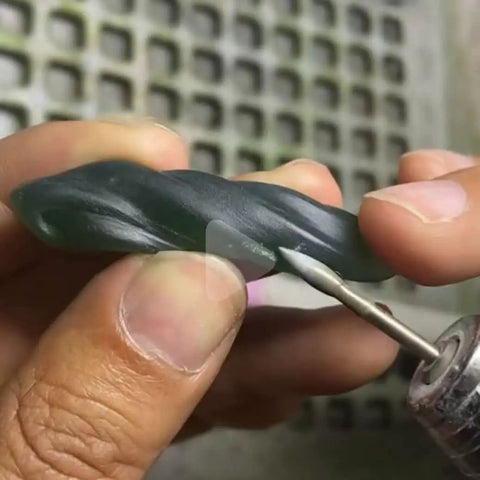 Using Olive Shape Diamond Burr Set, 11 Pcs, 3 By 32 Inch Shank Mounted Grinding Bits For Rotary Tool on stone piece.