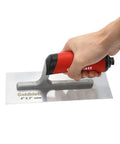 Person holding 8-Inch By 3-Inch Masonry Finishing Trowel With Soft Grip Handle, showing pre-shaped blade and stainless rivets.