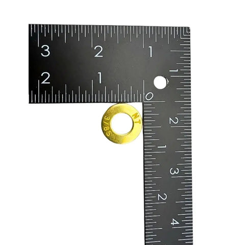 Close-up of a 3/8" SAE washer with ruler from Heavy-Duty 3/8-16 Grade 8 Hex Bolts 1-1/2 Inch With 10 Hardened Flat Washers And Nylon Lock Nuts Vibration-Resistant SAE J429 Fasteners For Tough Projects