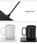 Versatile Electric Cup Warmer With Three Distinct Temperature Levels, showing white and black ceramic mugs on a sleek heated platter.
