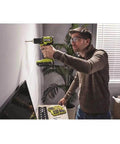 Man using Hard Hitting 18V Brushless Drill And Impact Driver Kit With Two 1 5Ah Batteries on a wall in a home setting.