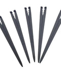 Five black plastic stakes for 50 Pack Irrigation Stakes For Quarter Inch Drip Tubing Keeps Drip Lines Off Ground Prevents Clogs Easy Install For 4mm And 7mm Hose Secures Tubing In Place And Lets You Move And Reconfigure Your Drip System On The Fly, showing pointed ends and clip designs to secure tubing.