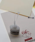 CA Glue Nozzle Extender Tips Set 200 Pieces For Precision Bottle Applicators in crafting setup with card and sticker