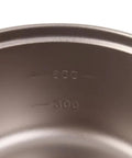 Close-up of Ultralight Titanium Camping Pot With Folding Handle, 900 Ml Capacity, inside volume markings visible.