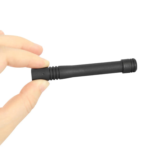 Hand holding UHF Stubby ATU 6DS Antenna for VX Series Radios, compact 3.7 inch black antenna, side view