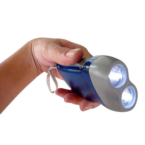Hand holding a blue Hand Crank Emergency Flashlight Four Pack Rechargeable Crank Light With Dual LED For Camping Car Travel