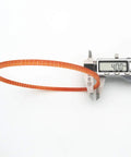 Two 13 1/4 Inch Motor Lug Belts For Sewing Machines, Replacement Belts 1314L MB340, 340mm Circumference, Fits Kenmore, Singer, White Brand Machines, Great For DIYers And Pros. Orange sewing machine motor lug belt measured at 340 mm with caliper.