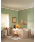 Quiet Low Noise Ceiling And Wall Ventilation Fan, 50 CFM, 4.0 Sones installed in a serene bathroom with tub and candles