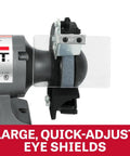 Close-up of Six Inch Bench Grinder With 3450 Rpm And Quarter Horsepower Motor featuring large, quick-adjust eye shields for safety.