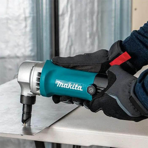 Person using 16 Gauge Nibbler for sheet metal cutting, ultra light 3.6 lb tool with 360 degree die and slim ergonomic grip