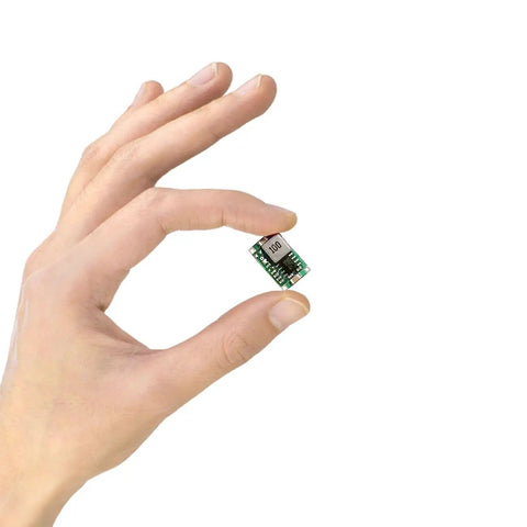 Hand holding Ten Pack Dope 3.3V Buck Converter Module From 5-24V Input To 3.3V Output, 1.5A DC-DC Regulator, compact size 17x11x3mm