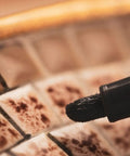 Close-up of Easy Fix White Tile Grout Paint Marker Kit 5 Pack With Narrow 5mm Tips Waterproof Colorant on tile edge