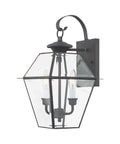 Westover Two Light Outdoor Wall Lantern In Charcoal Finish With Classic Clear Beveled Glass Old School Charm Transitional Traditional Style Exterior Sconce For Porch Patio Or Entryway Bulbs Not Included shown mounted on a wall, featuring a classic design with beveled glass.